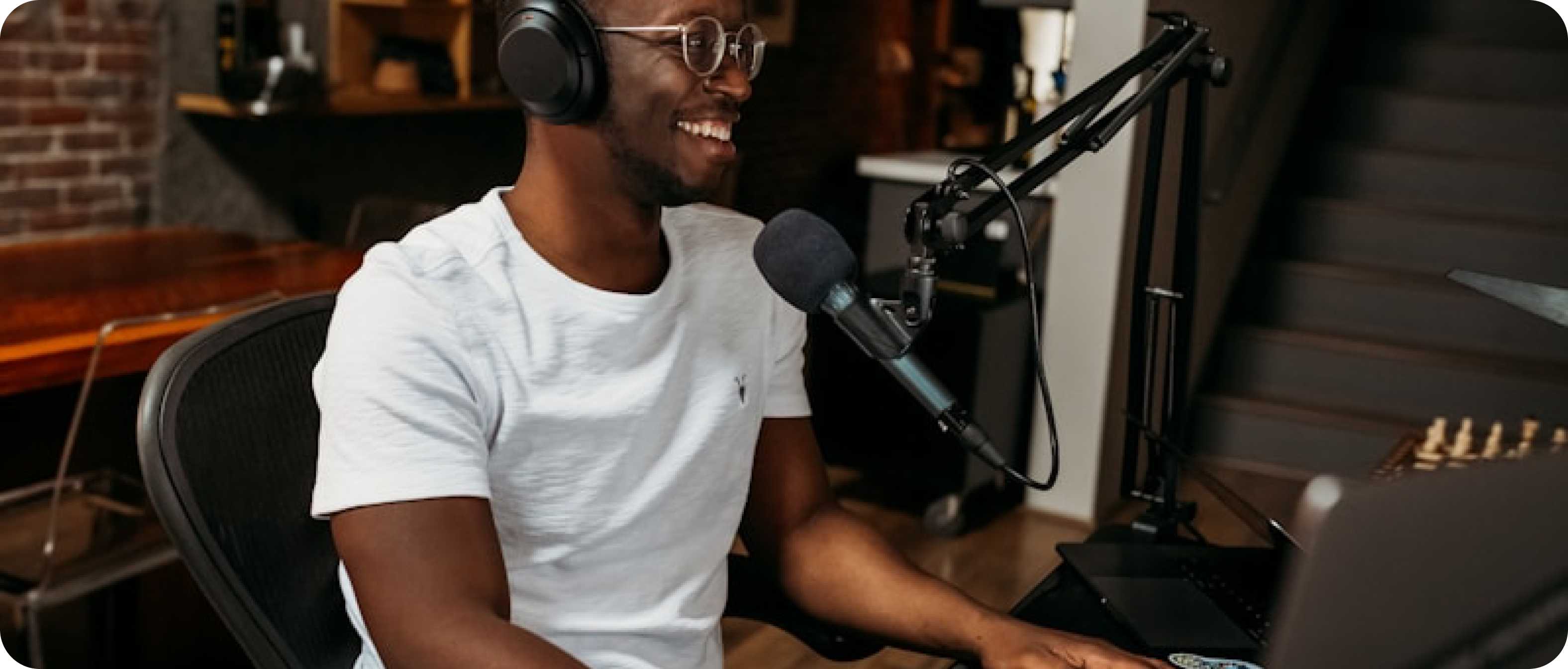 an image of a man smiling and creating video content